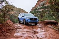 <p>The 2022 Honda Pilot gets more standard features than last year's model, but with those updates comes a substantial bump in its starting price by nearly $7000. Every Pilot now has LED headlights and taillights, a standard 8.0-inch touchscreen, and a 280-hp V-6 engine with a nine-speed automatic transmission. The Pilot's three rows provide plenty of room, and a host of active-safety tech is available. With standard all-wheel drive, a Honda Pilot Elite model returned 27 mpg on our highway fuel-economy test.</p><ul><li>Base price: $32,645</li><li><em>C/D </em>rating: 8.5/10 </li></ul><p><a class="link " href="https://www.caranddriver.com/honda/pilot/" rel="nofollow noopener" target="_blank" data-ylk="slk:MORE ABOUT THE PILOT;elm:context_link;itc:0;sec:content-canvas">MORE ABOUT THE PILOT</a></p>