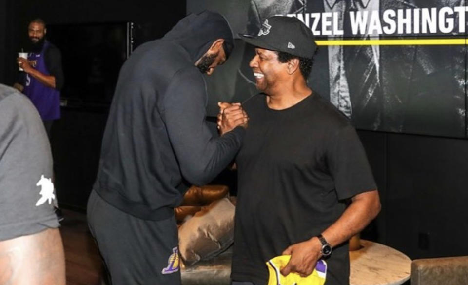 LeBron James greets Denzel Washington after the actor spoke to the Lakers as part of their “Genius Series.” (Instagram)