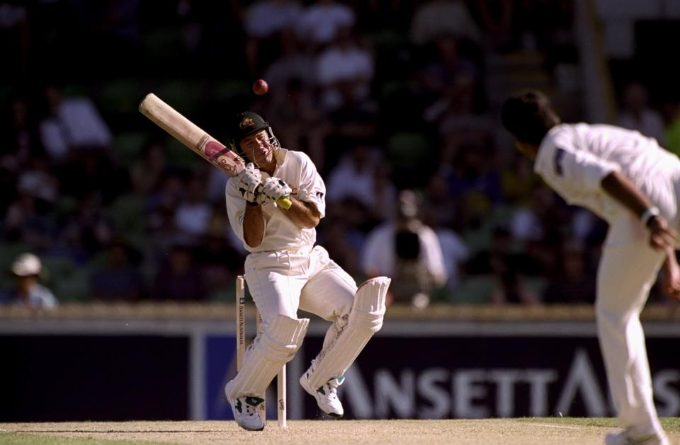 Ricky Ponting ducking out of the way of a bouncer.