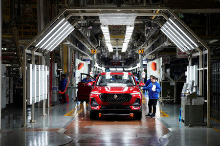 Employees work on Baojun RS-5 cars at a final assembly plant operated by General Motors Co and its local joint-venture partners in Liuzhou, Guangxi Zhuang Autonomous Region, China, February 28, 2019. REUTERS/Aly Song