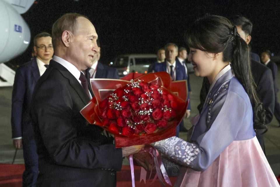 Russian President Vladimir Putin, left, is welcomed upon his arrival to meet with North Korea's leader Kim Jong Un at the Pyongyang Sunan International Airport outside Pyongyang, North Korea, on Tuesday, June 18, 2024. (Gavriil Grigorov, Sputnik, Kremlin Pool Photo via AP)