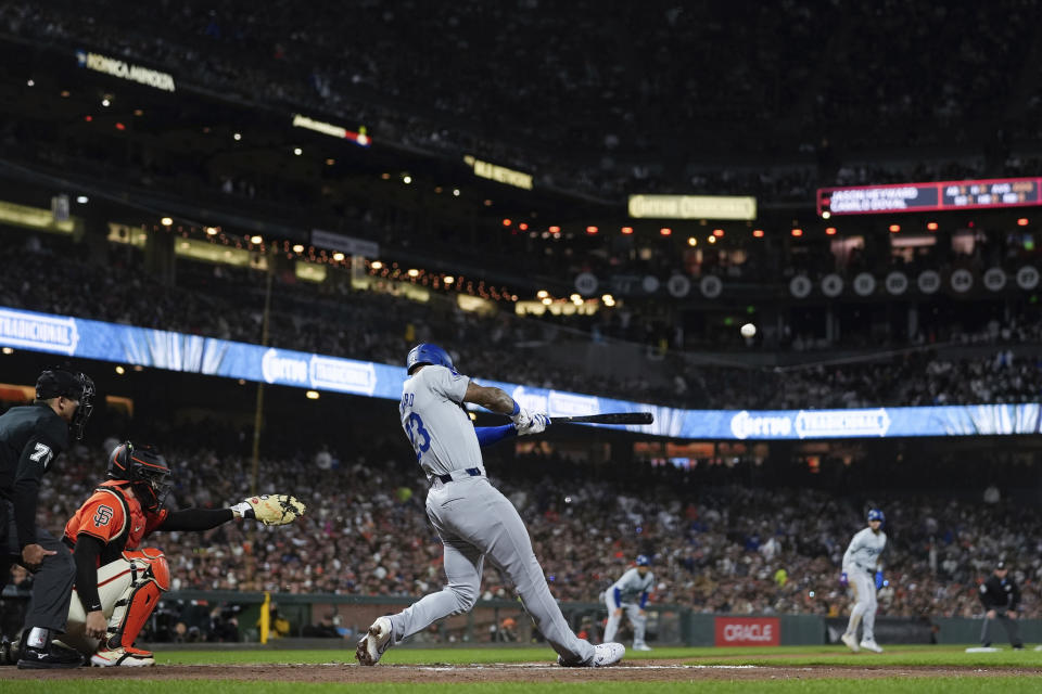 Los Angeles Dodgers' Jason Heyward hits a sacrifice fly against the San Francisco Giants during the ninth inning of a baseball game Friday, June 28, 2024, in San Francisco. (AP Photo/Godofredo A. Vásquez)