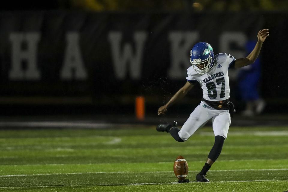 Winton Woods kicker Dan Umba Domobele (87) punts against La Salle in the second half at Lakota East High School. Nov. 12, 2021