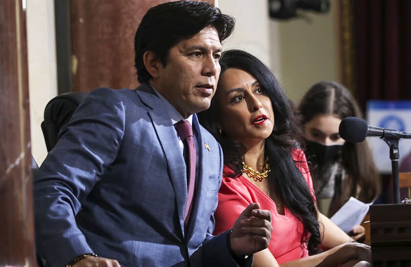 Councilman Kevin de León and then-council President Nury Martinez confer at an Oct. 4 council meeting.