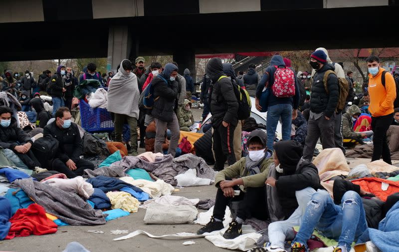 French gendarmes evacuate makeshift migrant camp in the outskirts of Paris