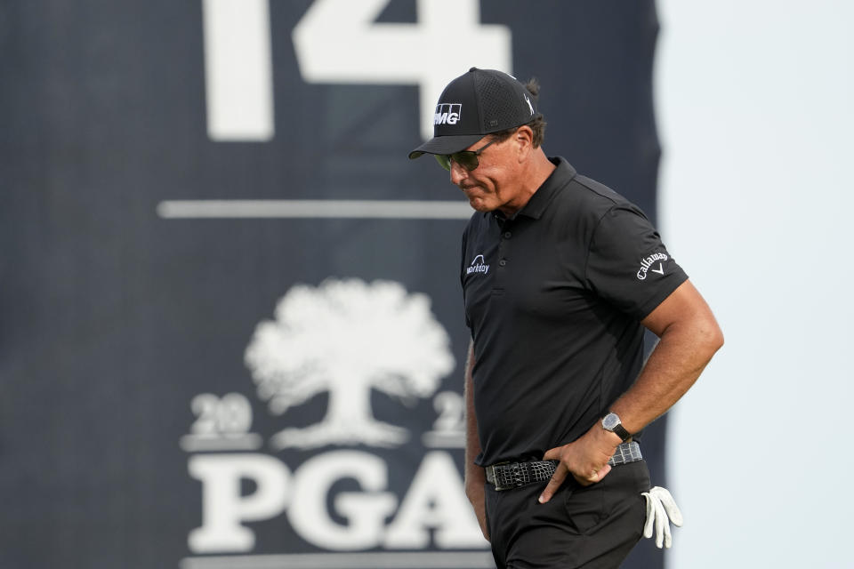 FILE - Phil Mickelson walks off the 14th green after missing a birdie putt during the third round at the PGA Championship golf tournament on the Ocean Course, Saturday, May 22, 2021, in Kiawah Island, S.C. Whether his true intentions were chasing Saudi Arabian money or gaining more control over how he thinks the PGA Tour should be run, Mickelson has been exposed for manipulating people to get what he wants. (AP Photo/David J. Phillip, File)