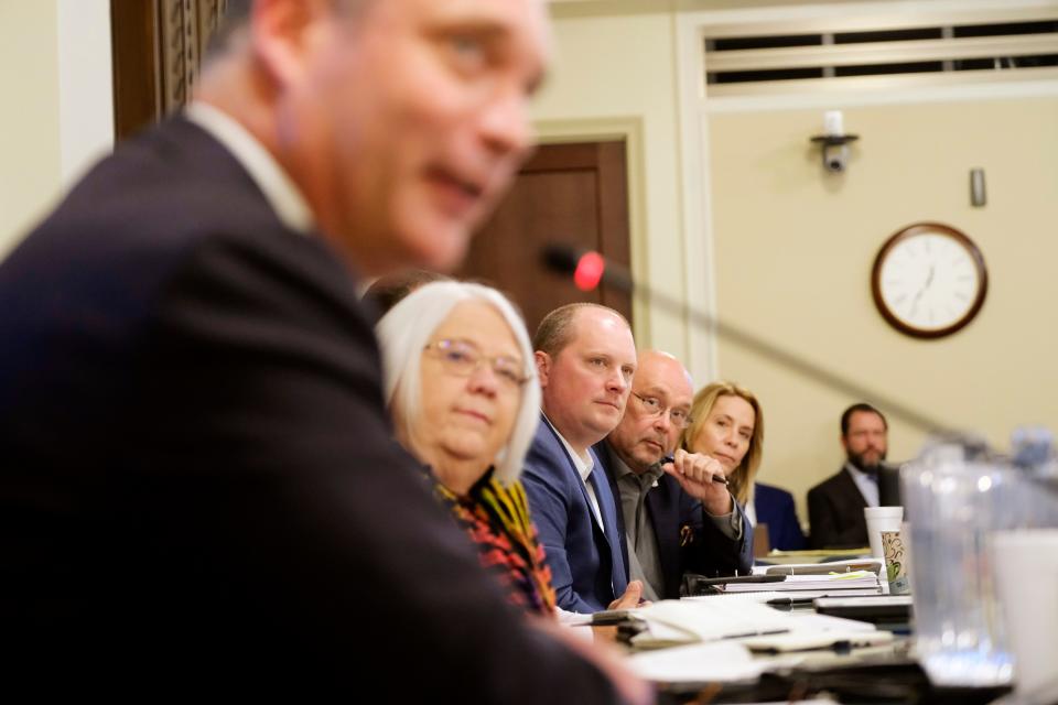 House members listen to House Speaker Charles McCall as he addresses a committee Tuesday.