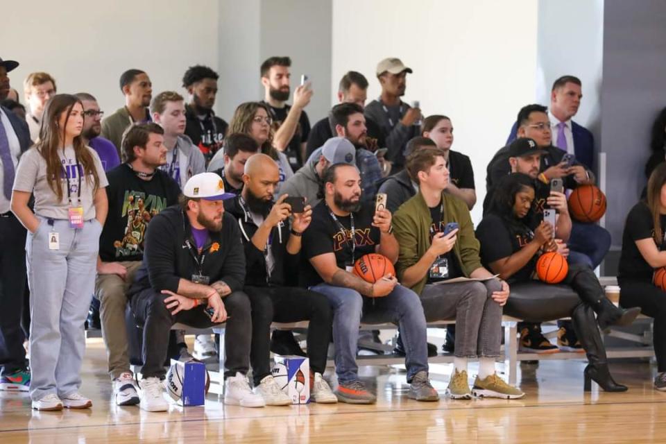 United Wholesale Mortgage team members watch the Phoenix Suns practice at their gym on Oct. 9, 2023, in Pontiac, Michigan.