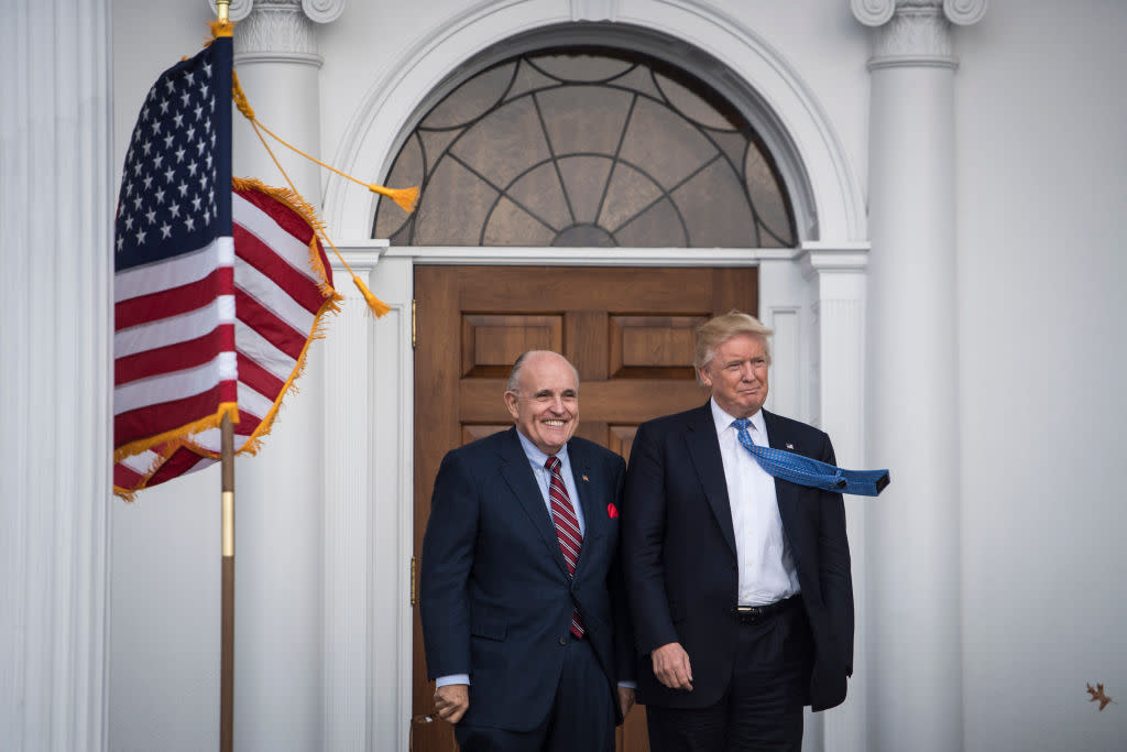  Donald Trump greets Rudy Giuliani at the clubhouse at Trump National Golf Club Bedminster. 