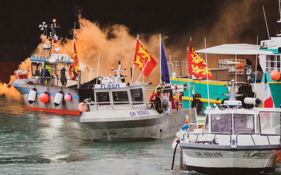 French fishermen angry over loss of access to waters gathered their boats in protest off the English Channel island of Jersey in May - Oliver Pinel