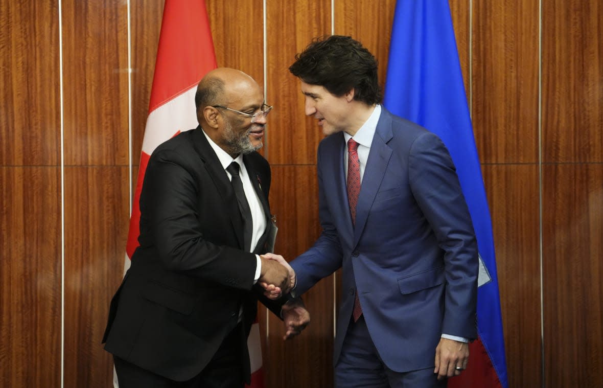 Prime Minister Justin Trudeau, right, takes part in a bilateral meeting with Prime Minister of Haiti Ariel Henry during the Conference of Heads of Government of the Caribbean Community (CARICOM) in Nassau, Bahamas, on Thursday, Feb. 16, 2023. (Sean Kilpatrick /The Canadian Press via AP)