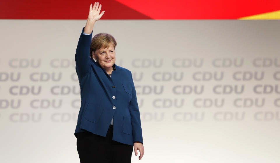 German Chancellor and chairwoman of the German Christian Democratic Union (CDU), Angela Merkel, waves after her farewell speech during a party convention of the CDU in Hamburg, Germany, Friday, Dec. 7, 2018. 1001 delegates are electing a successor of German Chancellor Angela Merkel who doesn't run for party chairmanship after more than 18 years at the helm of the party. (AP Photo/Michael Sohn)