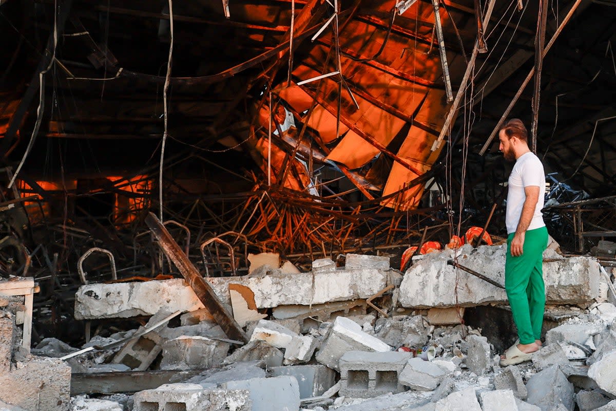 The wedding hall was reduced to charred metal and rubble (Reuters)