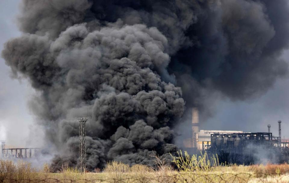 Smoke raises from an oil refinery in Lysychansk about 120km north of Donetsk (AFP via Getty Images)