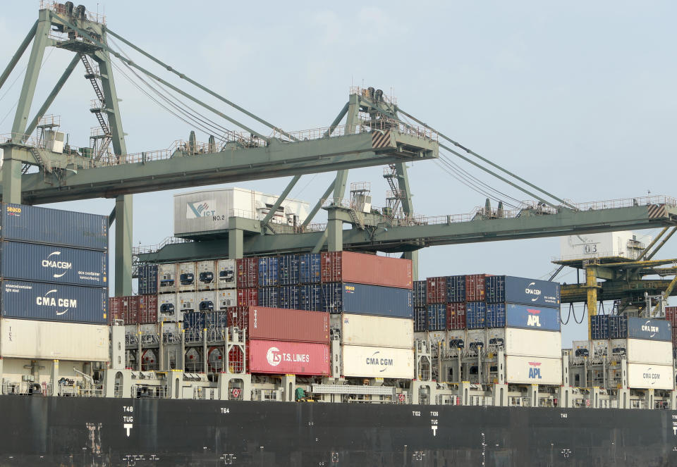 FILE - Containers are loaded on a ship at the Saigon port in Ho Chi Minh City, Vietnam on May 3, 2020. Vietnam's economy slowed sharply in the first quarter of the year 2023, hit by rising costs and weaker demand for its exports.(AP Photo/Hau Dinh, File)