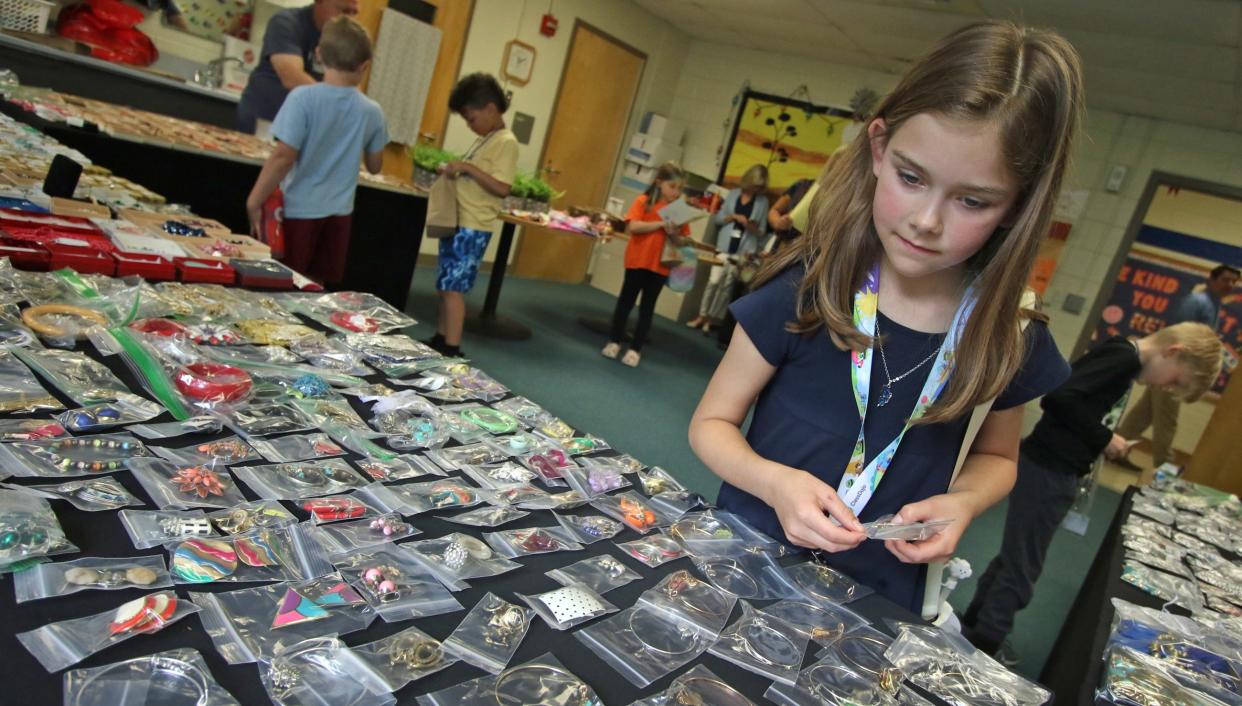 Hadley Webb looks for the perfect bracelet as a group of 2nd graders look to pick out a free gift to give for Mother’s Day Tuesday morning, May 7, 2024, at Cherryville Elementary School.