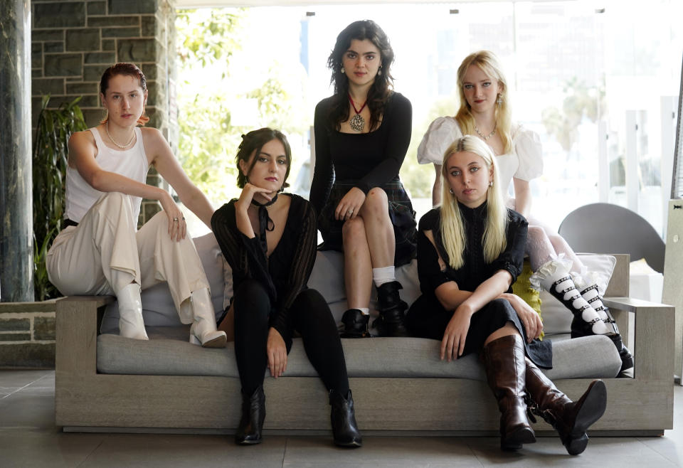 Lizzie Mayland, from left, Aurora Nishevci, Abigail Morris, Emily Roberts (top) and Georgia Davies of the indie rock band The Last Dinner Party pose for a portrait, Tuesday, Nov. 7, 2023, at the AC Hotel by Marriott in Los Angeles. (AP Photo/Chris Pizzello)