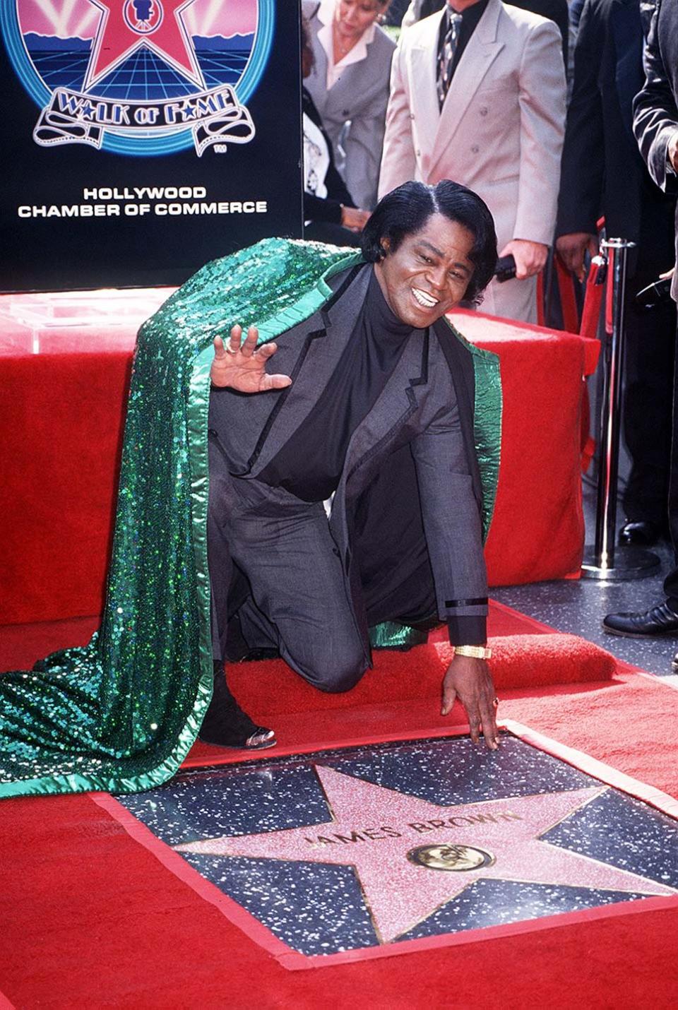 1997: James Brown dons his famous cape for the ceremony