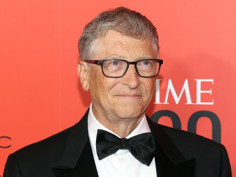 A photograph of Bill Gates wearing a bow-tie and suit whilst smiling.