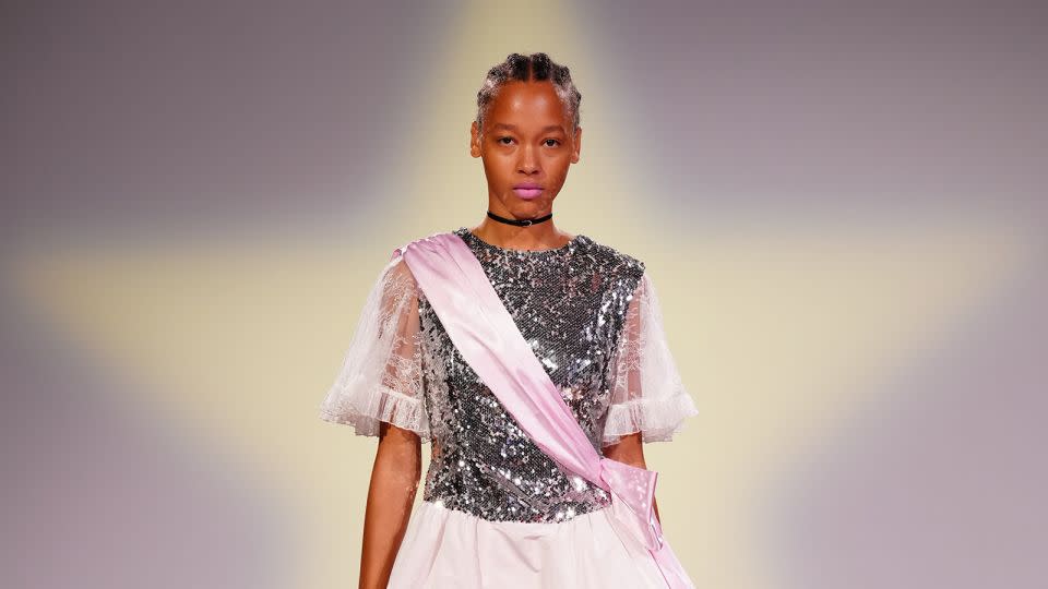 From prom queen sashes to '80s puff-sleeved silhouettes, the brand's mission was to unite style and substance: "Practicality can be fantastic and fantasy can be practical," read the show notes. - Filippo Fior/Sandy Liang