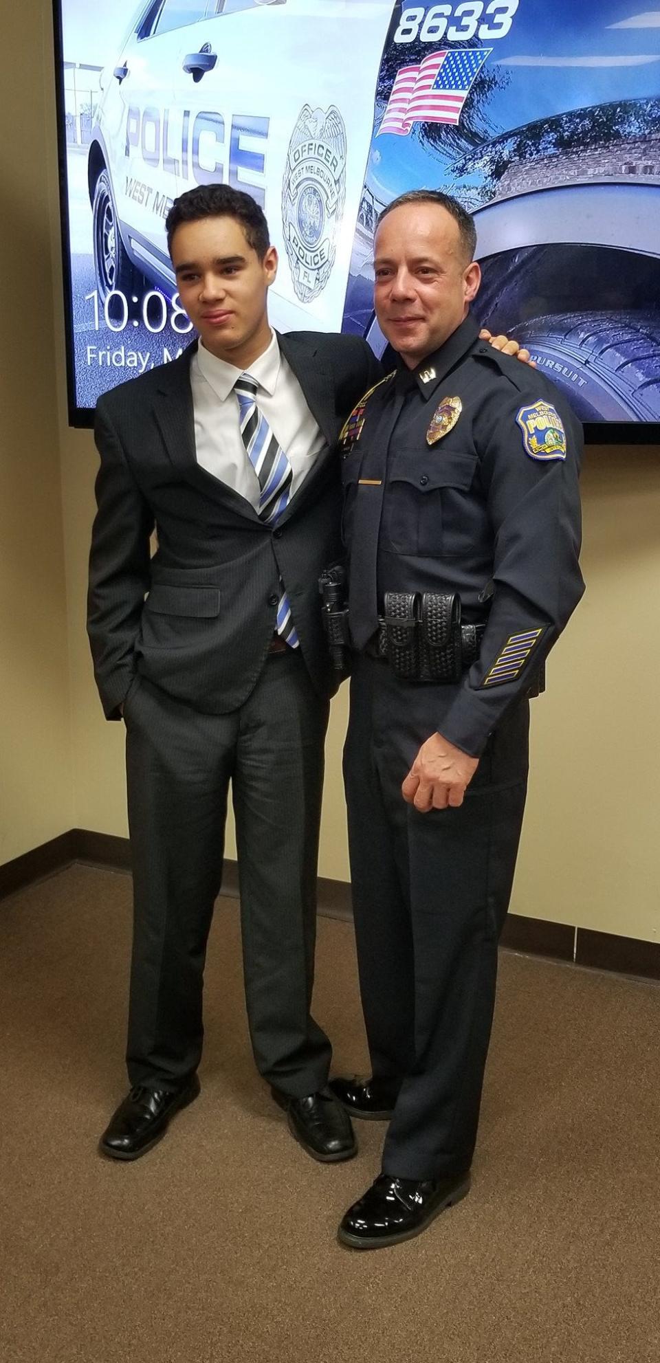 West Melbourne Police Capt. Carlos Navedo with his son Brandon.