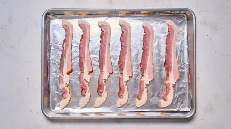 strips of bacon on sheet tray