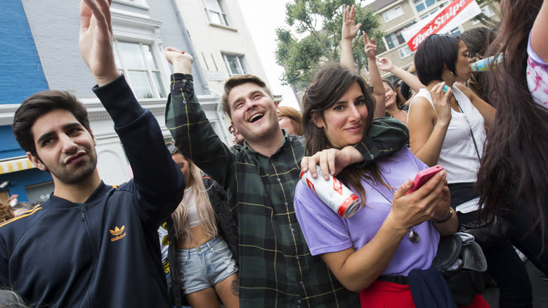 People dancing with Red Stripe