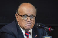 FILE - Former New York City Mayor Rudy Giuliani reacts during a talk radio show at the WABC studios in New York Sept. 10, 2021. The House committee investigating the Capitol insurrection has issued subpoenas to some of Donald Trump's closest advisers, including Rudy Giuliani. (AP Photo/Robert Bumsted, File)
