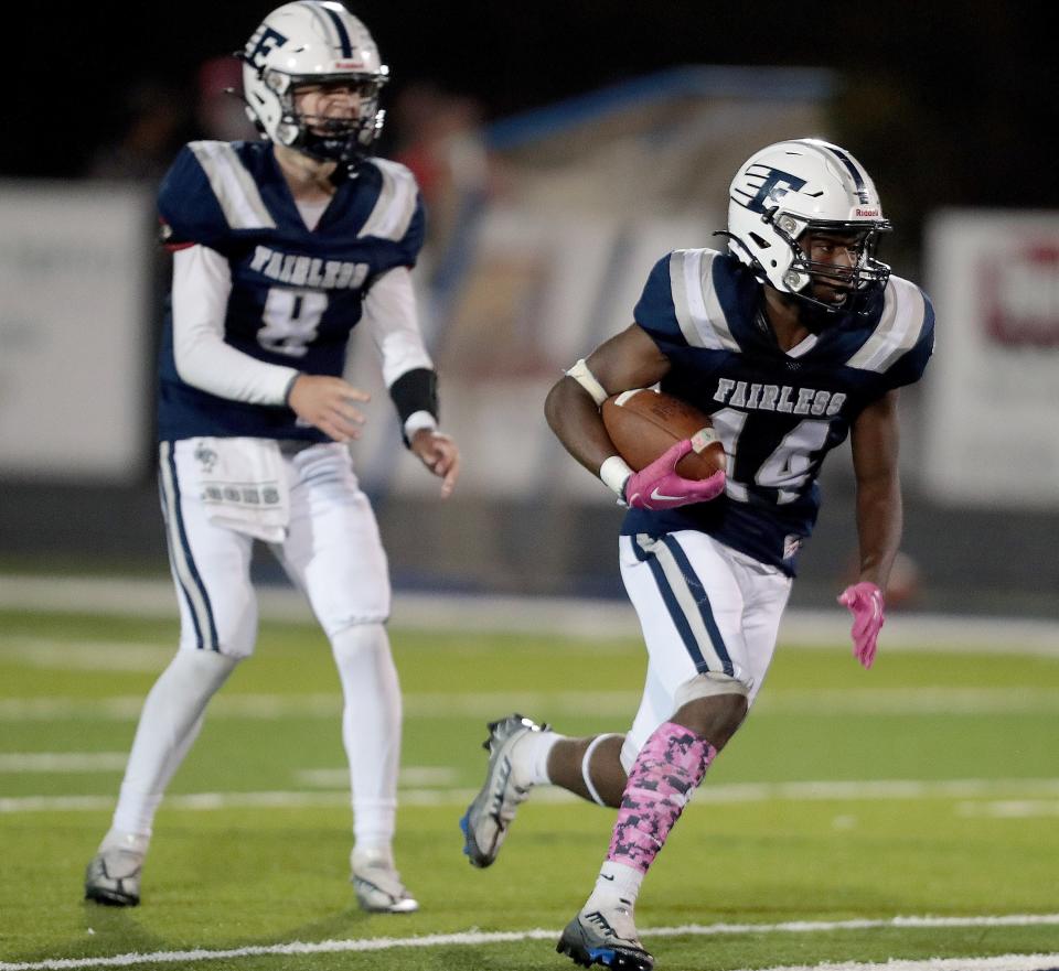 Fairless quarterback Carson Colucci and running back Peter Killy (14), in action at home a year ago, helped the Falcons roll to a win Friday.