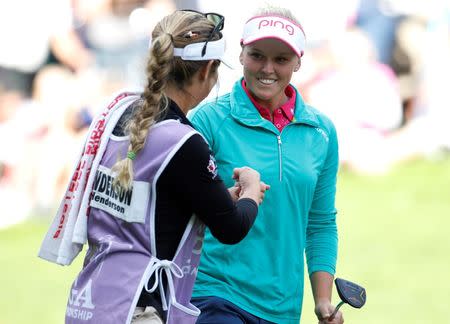Jun 12, 2016; Sammamish, WA, USA; Brooke Henderson, right is congratulated by her caddie and sister Brittany Henderson after sinking her putt on the eighteenth hole during the final round of the KPMG Women's PGA Championship at Sahalee Country Club - South/North Course. Mandatory Credit: Joe Nicholson-USA TODAY Sports