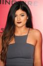 <p>A few years before she launched Kylie Cosmetics, the youngest Jenner stepped out wearing dark berry lipstick.</p>
