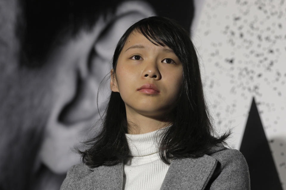 FILE - In this Jan. 28, 2018, file photo, Agnes Chow, a member of democracy activist Joshua Wong's Demosisto party, attends a protest in Hong Kong. Demosisto, a pro-democracy group in Hong Kong posted on its social media accounts that well-known activist Joshua Wong had been pushed into a private car around 7:30 a.m. Friday, Aug. 30, 2019 and was taken to police headquarters. It later said another member, Agnes Chow, had been arrested as well. (AP Photo/Vincent Yu, File)