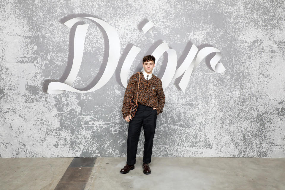 LONDON, ENGLAND - DECEMBER 08:  Tom Daley attends the Dior Men's Fall 2022 show at Olympia Grand on December 9, 2021 in London, England. (Photo by David M. Benett/Dave Benett/Getty Images for Dior)