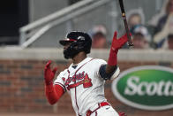 Atlanta Braves' Adeiny Hechavarria (24) drives in a run with a base hit in the first inning of a baseball game against the Miami Marlins Wednesday, Sept. 23, 2020, in Atlanta. (AP Photo/John Bazemore)