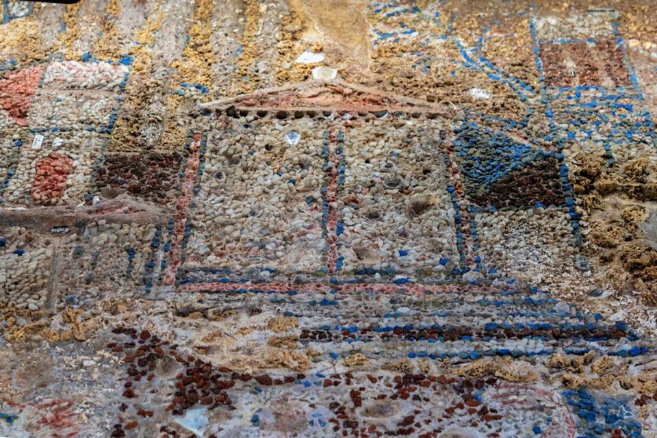 A close-up photo showing the center building of the mosaic’s upper section.