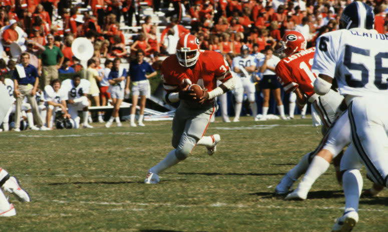 Georgia legend Herschel Walker runs the ball.