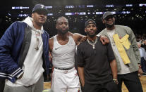 Carmelo Anthony, Miami Heat guard Dwyane Wade, Houston Rockets guard Chris Paul and Los Angeles Lakers forward LeBron James. from left, pose for a photographs on the court after Wade's final NBA basketball game, against the Brooklyn Nets on Wednesday, April 10, 2019, in New York. (AP Photo/Kathy Willens)