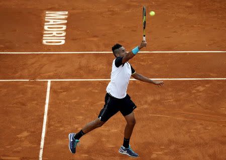 Nick Kyrgios of Australia returns the ball to Roger Federer of Switzerland during their match at the Madrid Open tennis tournament in Madrid, Spain, May 6, 2015. REUTERS/Susana Vera