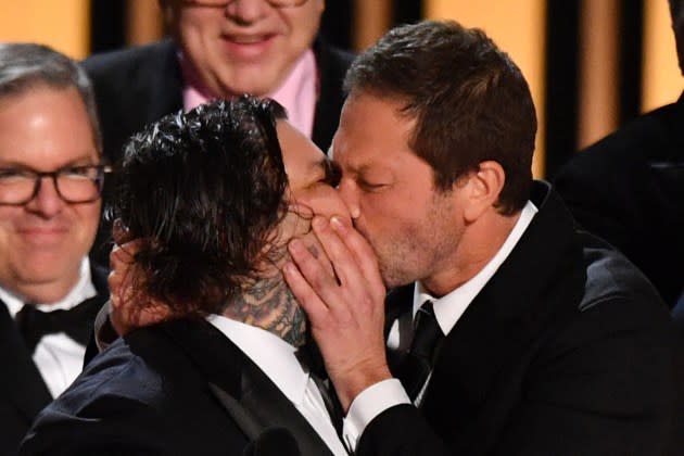 US actor Ebon Moss-Bachrach (R) kisses Canadian chef and actor Matty Matheson as the cast and crew of "The Bear" accept the award for Outstanding Comedy Series onstage during the 75th Emmy Awards at the Peacock Theatre at L.A. Live in Los Angeles on January 15, 2024. (Photo by Valerie Macon / AFP)  - Credit: VALERIE MACON/AFP/Getty Images