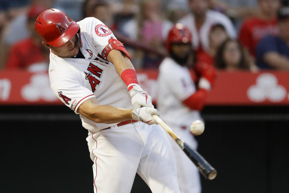 Los Angeles Angels' Mike Trout hits a RBI-single against the Boston Red Sox during the second inning of a baseball game in Anaheim, Calif., Saturday, Aug. 31, 2019. (AP Photo/Chris Carlson)