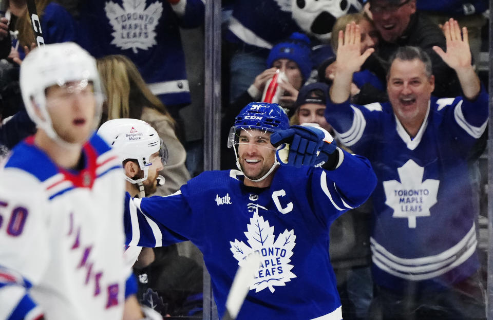 Toronto Maple Leafs' John Tavares (91) celebrates his goal against the New York Rangers during the third period of an NHL hockey game in Toronto on Saturday, March 2, 2024. (Frank Gunn/The Canadian Press via AP)