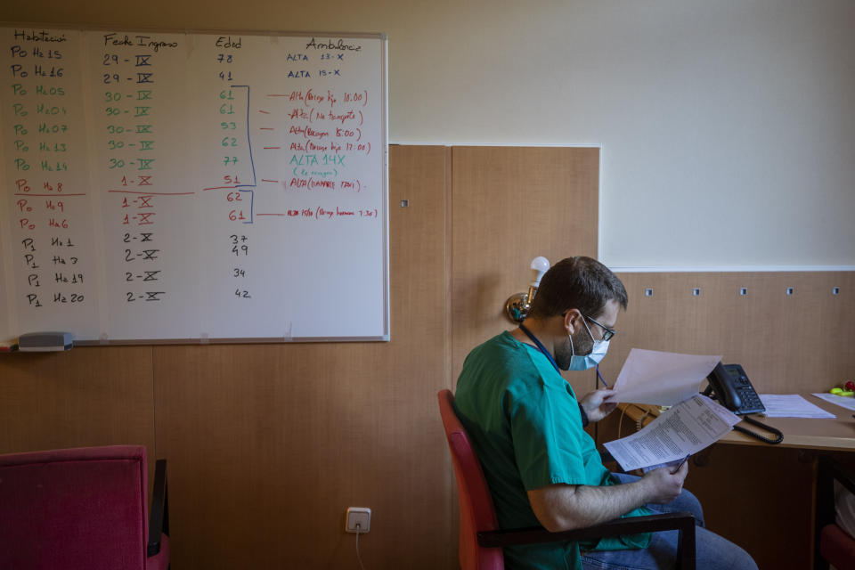 A board shows discharge information of coronavirus patient at a hotel in Leganes, outskirts of Madrid, Spain, Thursday, Oct. 15, 2020. The NH Leganes is one of the hotels run by health professionals to quarantine COVID-19 patients from Madrid area. (AP Photo/Bernat Armangue)