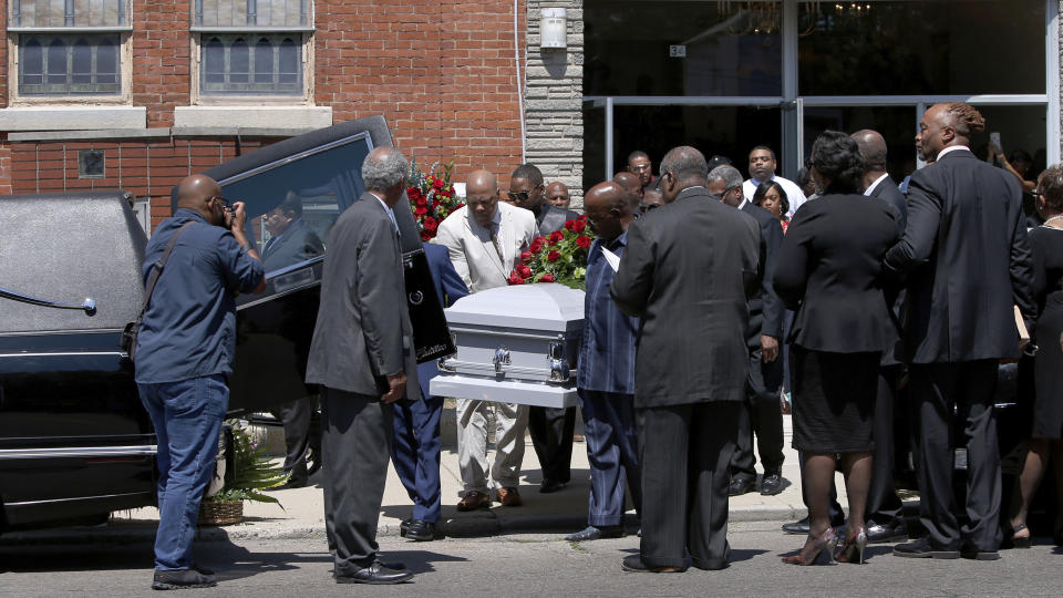 Derrick Fudge's casket is loaded into a hearse on Saturday, Aug. 10, 2019, outside a church in Springfield, Ohio. Fudge, 57, was the oldest of nine who were killed when a gunman opened fire outside a bar early Sunday in Dayton, Ohio. (AP Photo/Angie Wang)