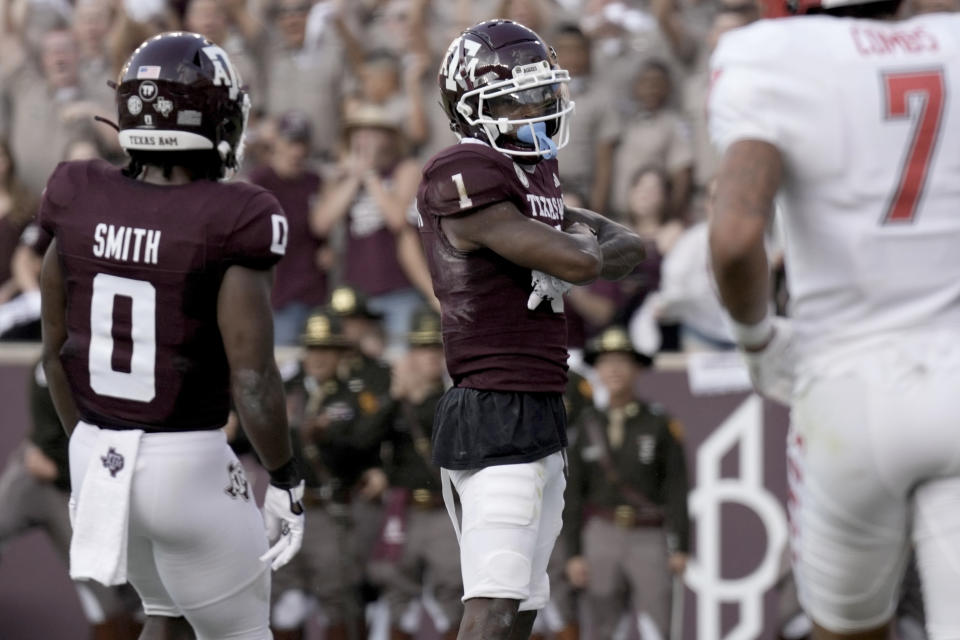 Texas A&M wide receiver Evan Stewart (1) reacts after scoring a touchdown against New Mexico during the second half of an NCAA college football game Saturday, Sept. 2, 2023, in College Station, Texas. (AP Photo/Sam Craft)