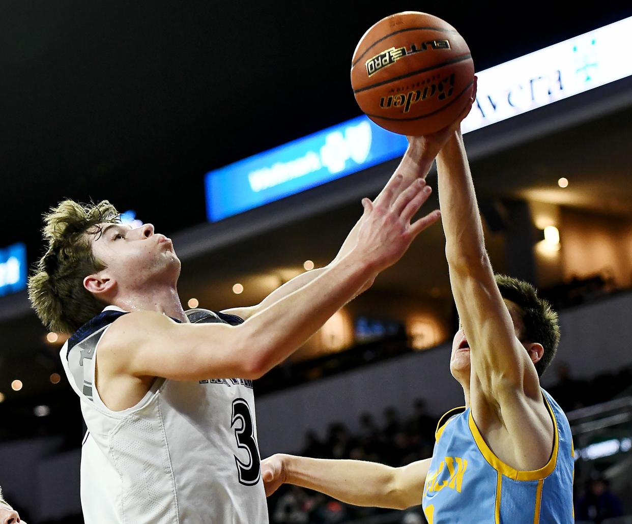 Dakota Valley's Isaac Bruns puts up a shot against Hamlin's Brennan Keszler during the Class A basketball semifinals. Dakota Valley won the title and is the boys high school team of the year for 2023.