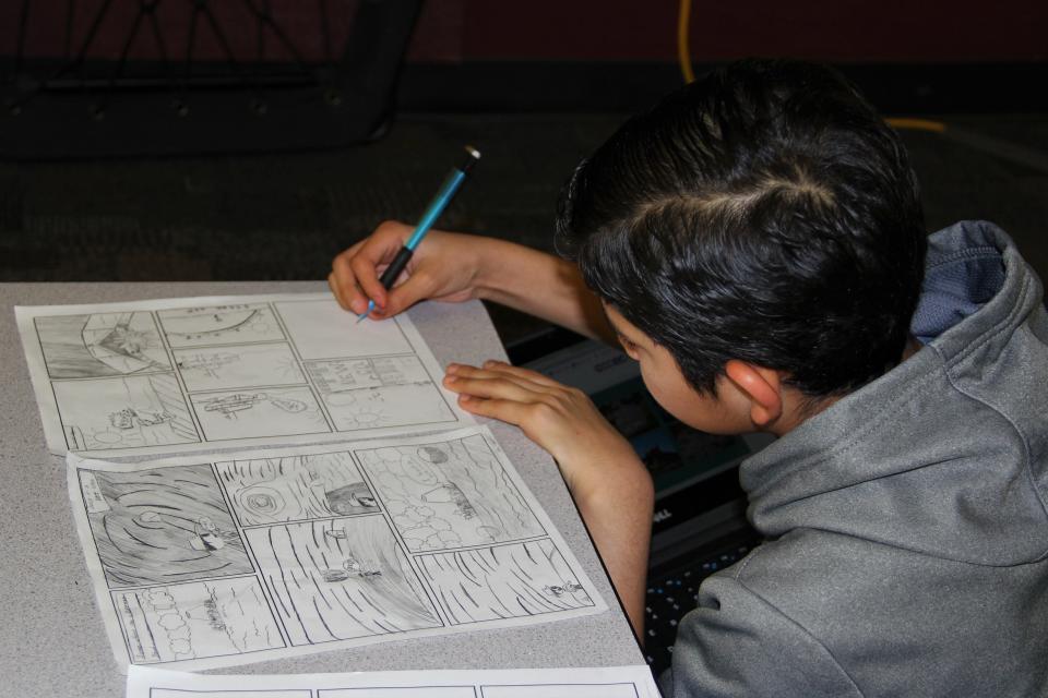 Students in a seventh grade science class at Rhodes Junior High in Mesa, Arizona, set their laptops aside to focus on a project in which they have to draw the geologic changes to a single site in comic form.