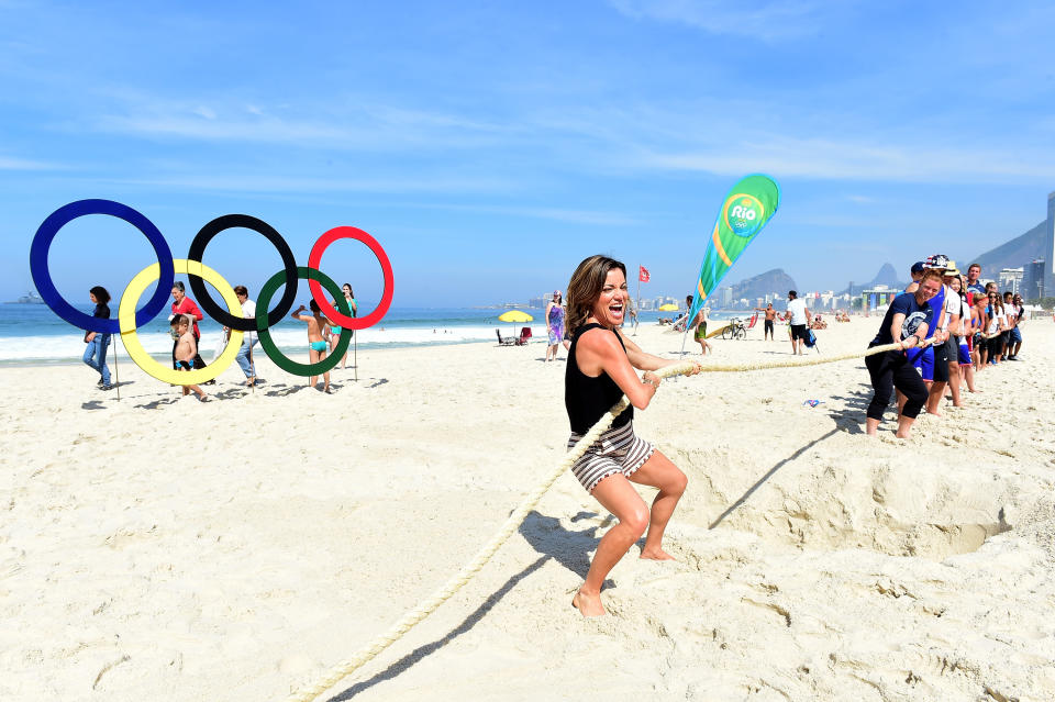 RIO DE JANEIRO, BRAZIL - AUGUST 16:  (BROADCAST - OUT) Access Hollywood host, Kit Hoover in a tug of war against United States Olympians on the Today show set on Copacabana Beach on August 16, 2016 in Rio de Janeiro, Brazil.  (Photo by Harry How/Getty Images)