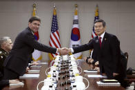 U.S. Defense Secretary Mark Esper, left, shakes hands with South Korean Defense Minister Jeong Kyeong-doo, right, during their meeting Friday, Nov. 15, 2019 in Seoul, South Korea. (Chung Sung-Jun/Getty Images via AP)