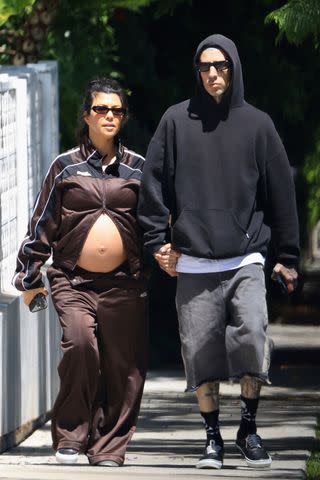 <p>GAMR / BACKGRID</p> Kourtney Kardashian and Travis Barker in West Hollywood in August 2023