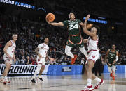 Miami guard Nijel Pack (24) scores against Indiana during the first half of a second-round college basketball game in the NCAA Tournament Sunday, March 19, 2023, in Albany, N.Y. (AP Photo/Hans Pennink)